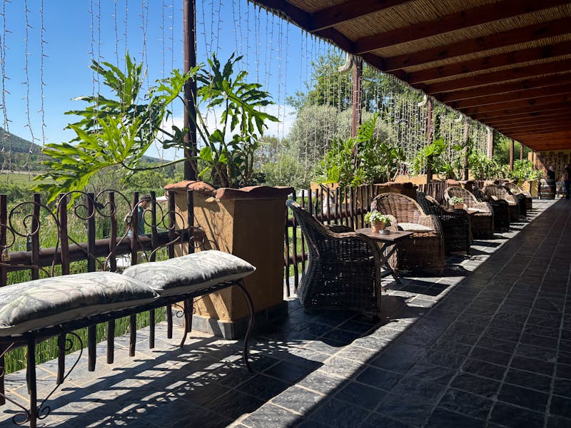 Outdoor patio seating area at Seasons Pizza restaurant